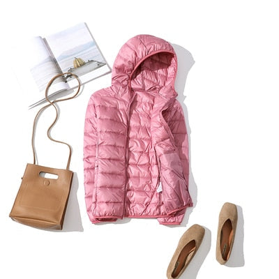 Women's short quilted winter jacket zip-front warm casual coat sleek hip-length silhouette