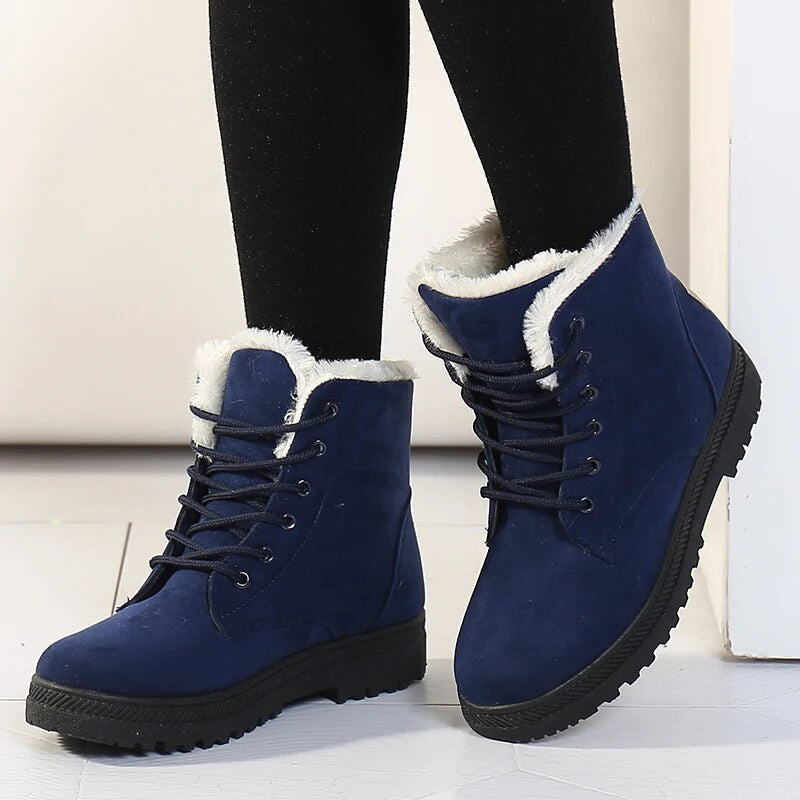Women's black slip-on ankle boots with warm fleece lining and water-resistant synthetic upper