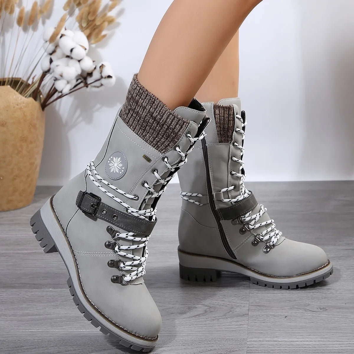 Women's brown lace-up boots with chunky heel, buckle detail, and warm lining for winter wear