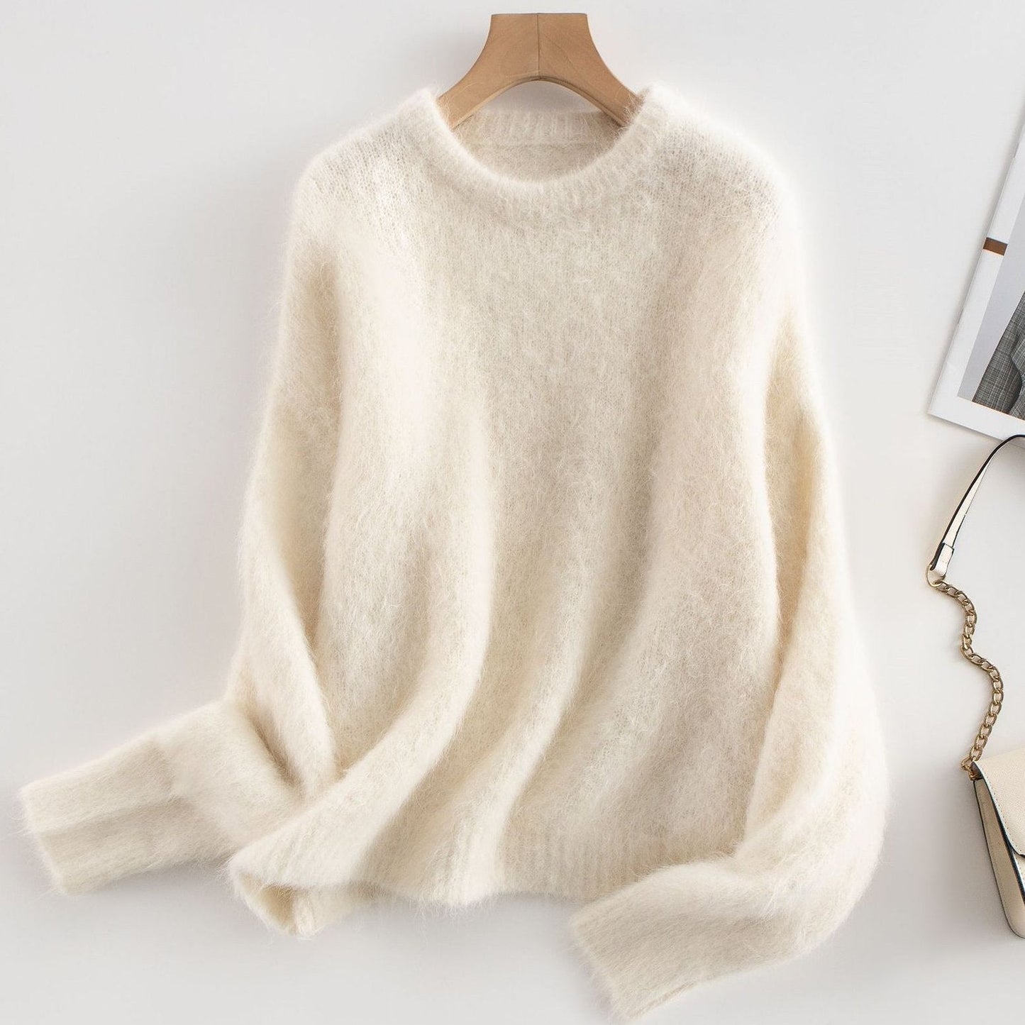 Women's relaxed fit ribbed wool sweater in neutral tone, cozy casual style with textured knit detail