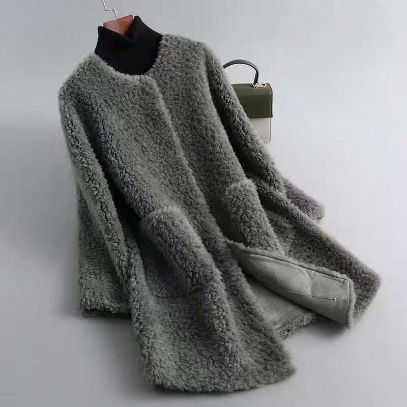 Women's oversized shaggy wool knee-length coat in neutral tone with open front relaxed silhouette