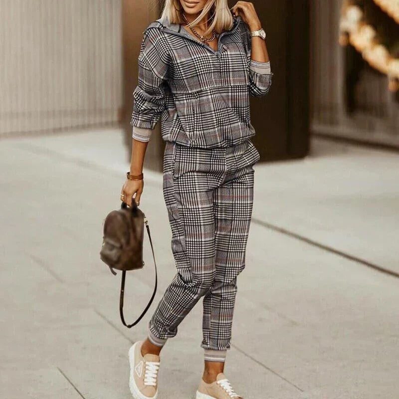 Women's relaxed zip tracksuit set with bold animal print accents, streetwear two-piece lounge travel style