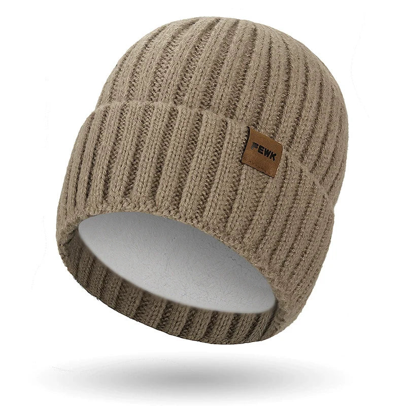 Dark knit unisex beanie with folded ribbed cuff and subtle stitched patch for casual everyday wear