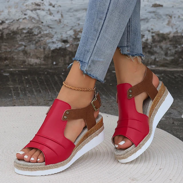 Women's open toe wedge sandals in neutral tone with adjustable buckle strap and cushioned sole