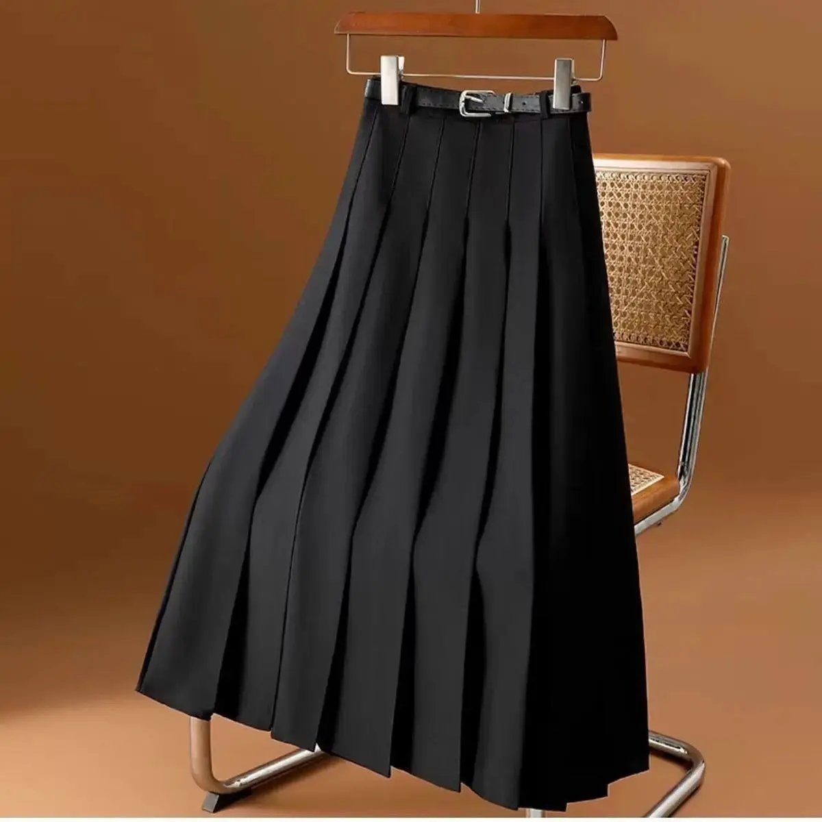 Black pleated midi skirt for women with elegant pleats and coordinating cinch belt