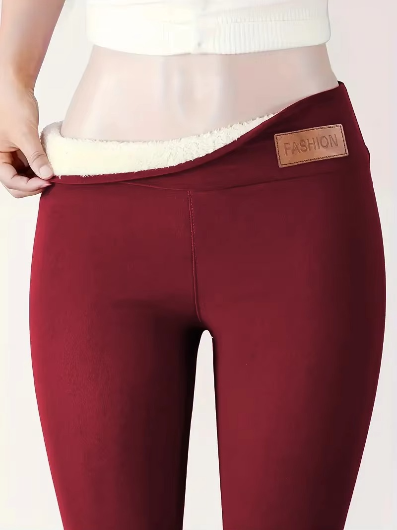 Women's black fleece-lined high-waist thermal leggings with plush interior for cold weather comfort