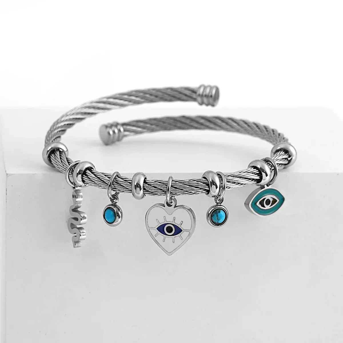 Isabella twisted cuff bracelet women evil eye charms open-end design everyday elegance silver