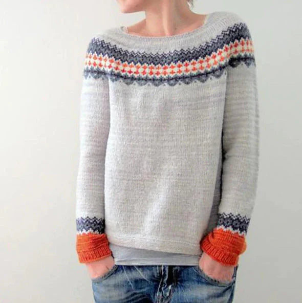 Women's winter knit sweater with bold color-block pattern and cozy warm comfort for cold days