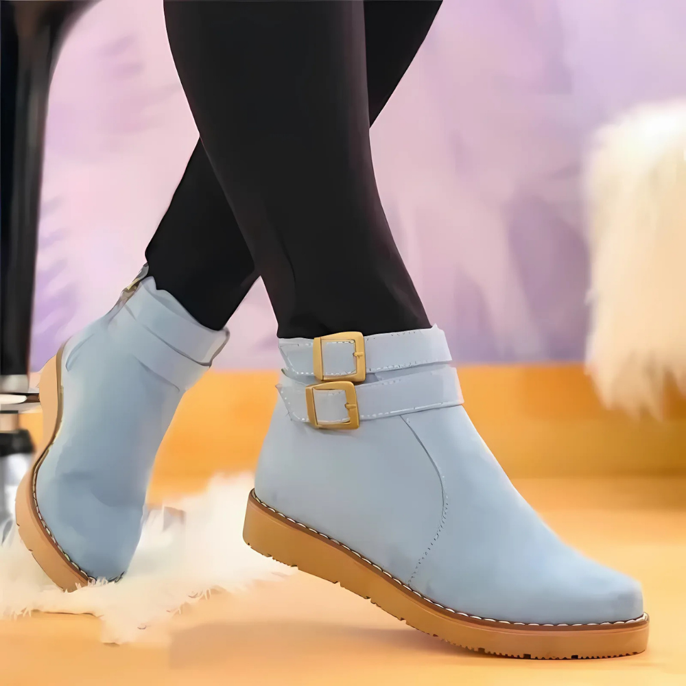 Women's structured ankle boots with double buckle straps, thick textured soles, edgy chic style
