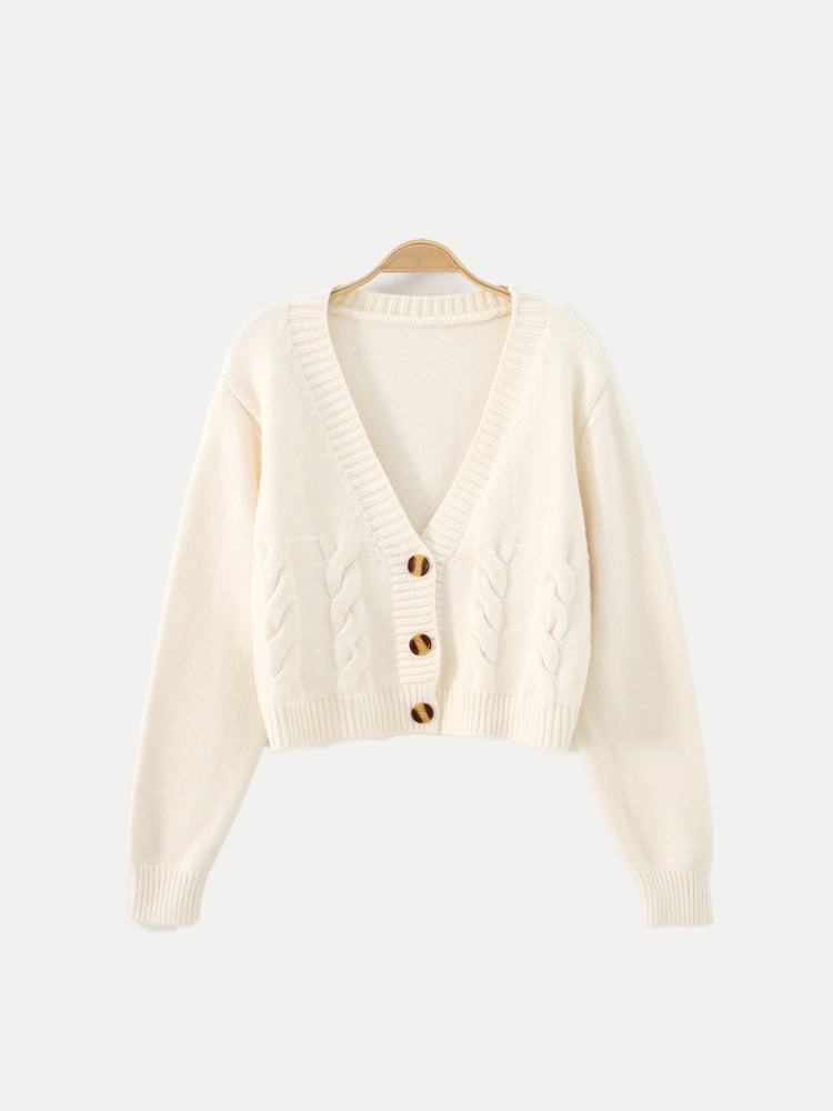 Women's cream cable knit crop sweater with V-neck button placket, cropped waist silhouette