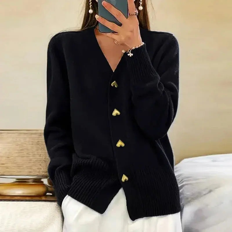 Women's cozy V-neck cardigan sweater, versatile layering piece with distinctive button details