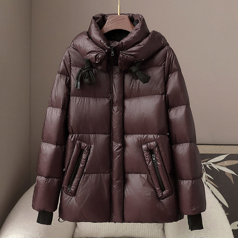 Women's black quilted hooded puffer jacket relaxed fit hip-length with textured finish
