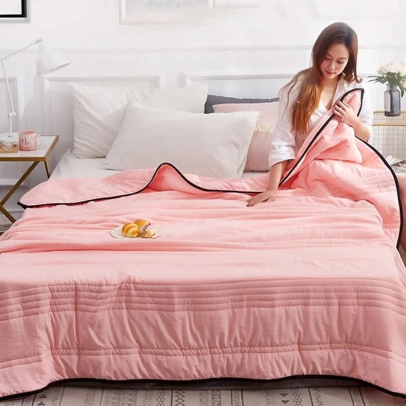 Lightweight cooling blanket soft quilted cotton pink accent breathable moisture-wicking for warm sleepers