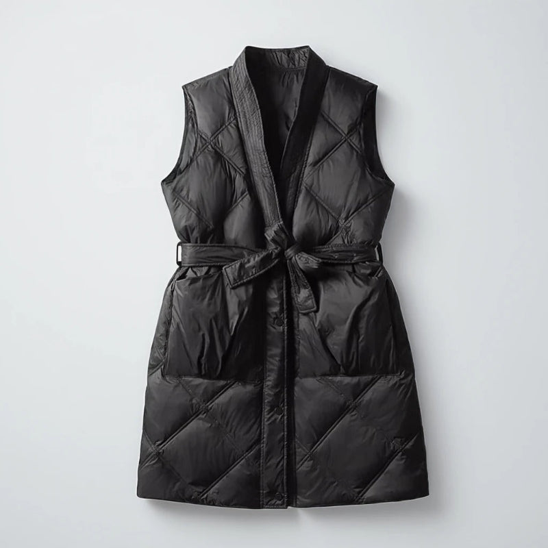 Women's quilted belted mid-thigh vest, chic layering piece with flattering silhouette and textured design