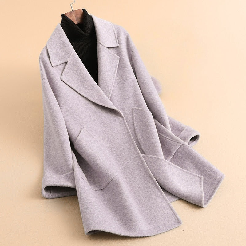 Women's relaxed fit knee-length wool-blend coat with notched lapel and patch pockets