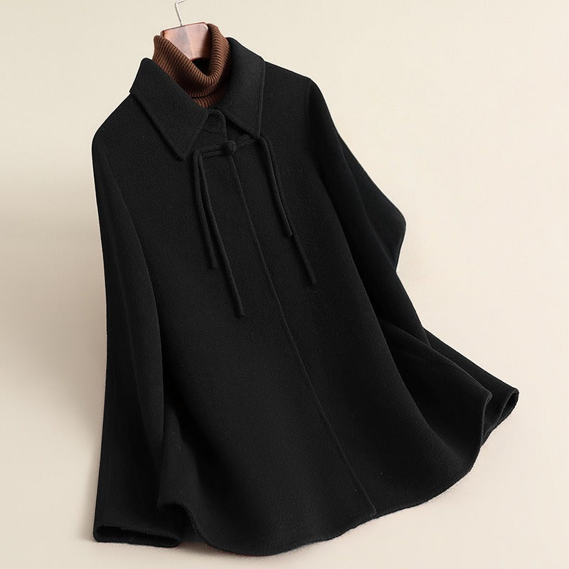 Women's relaxed fit cape coat collared thigh-length silhouette with frog closure refined details