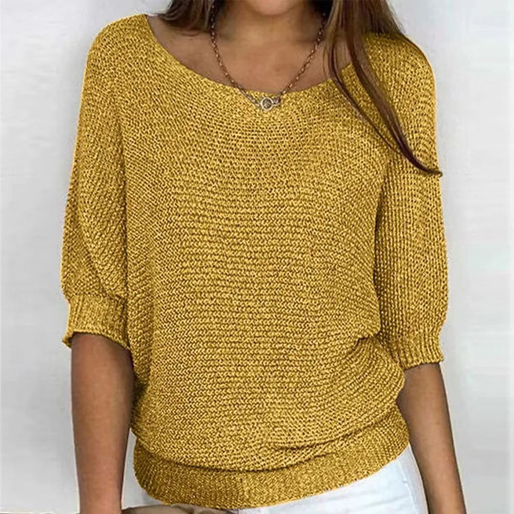 Women's relaxed fit knit sweater with statement puff sleeves and ribbed edges for casual everyday style