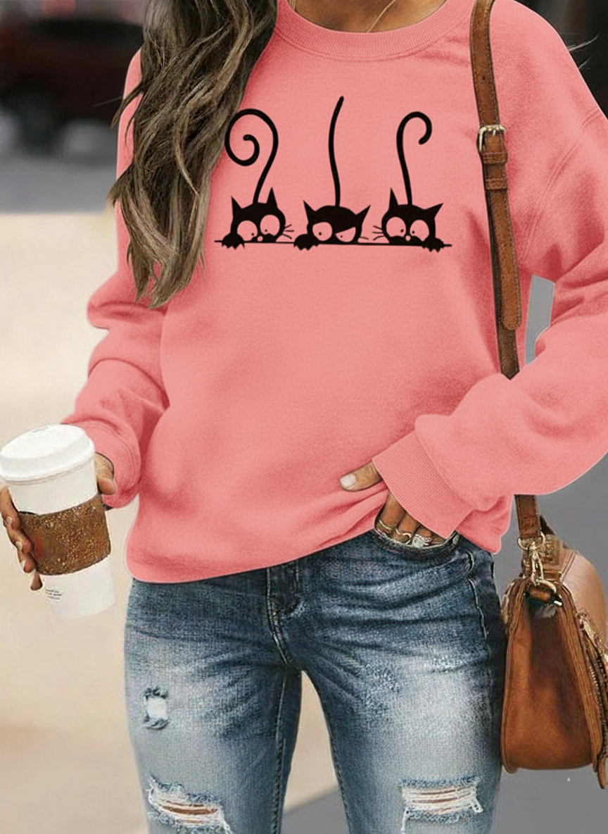 Women's oversized relaxed-fit sweatshirt in soft cotton blend featuring a playful cat print design