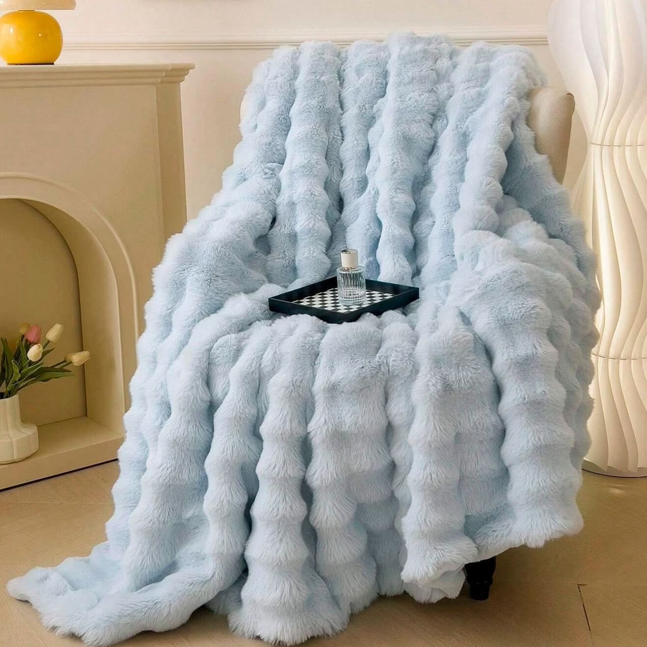 Light blue plush faux fur throw blanket with chunky minimalist texture, double-sided for couch or bed