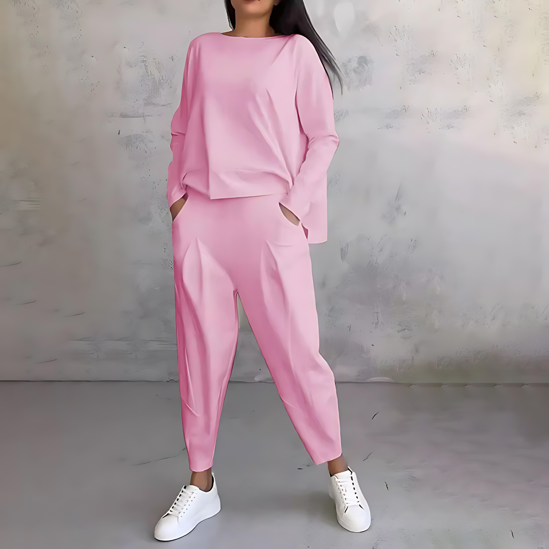Women's loose fit two-piece set with flowy long-sleeve top and tapered pants for chic travel style