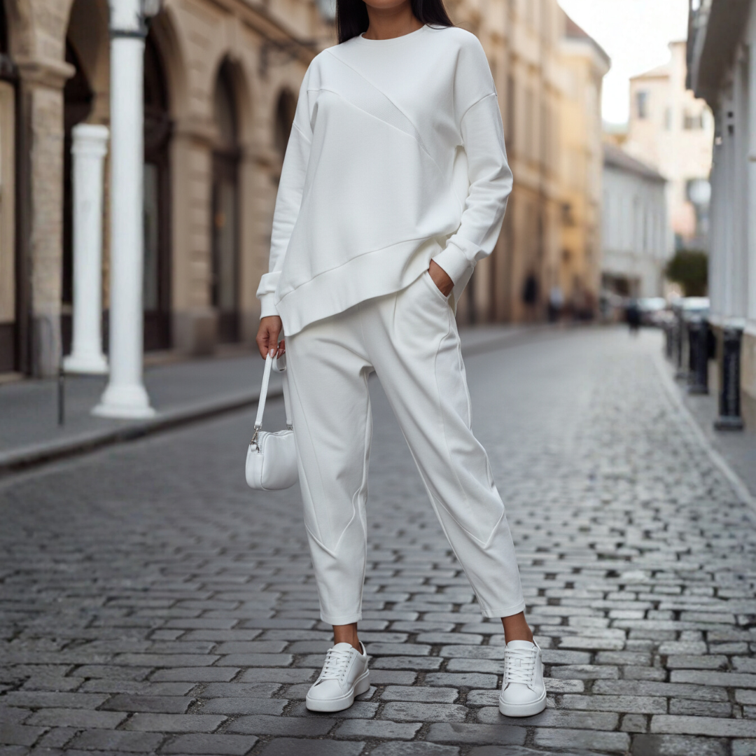 Women's soft knit two-piece pants set in neutral tone, relaxed coordinated matching shirt and pants