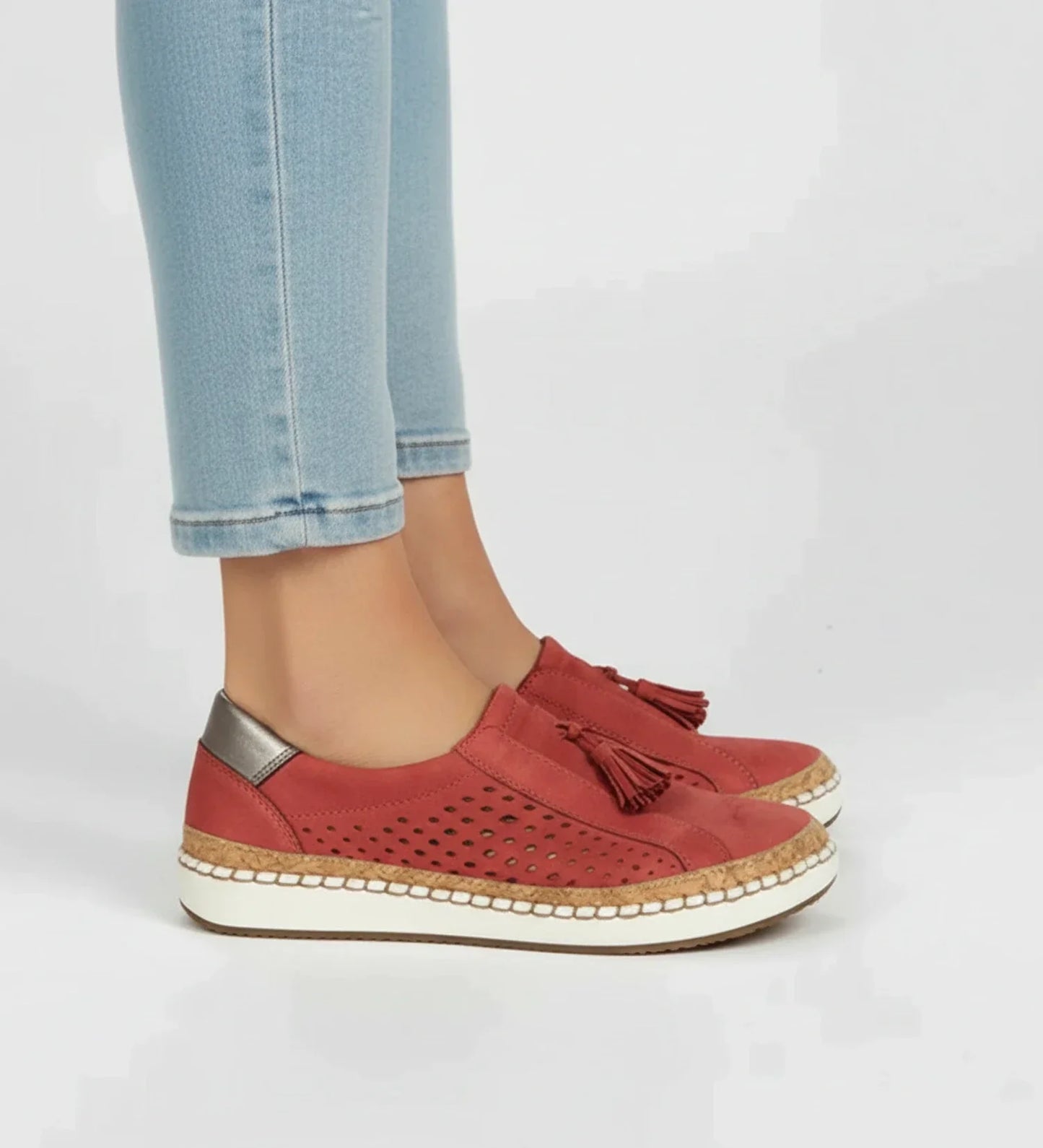 Women's slip-on perforated tassel loafer sneaker in neutral tone with breathable upper and laceless design