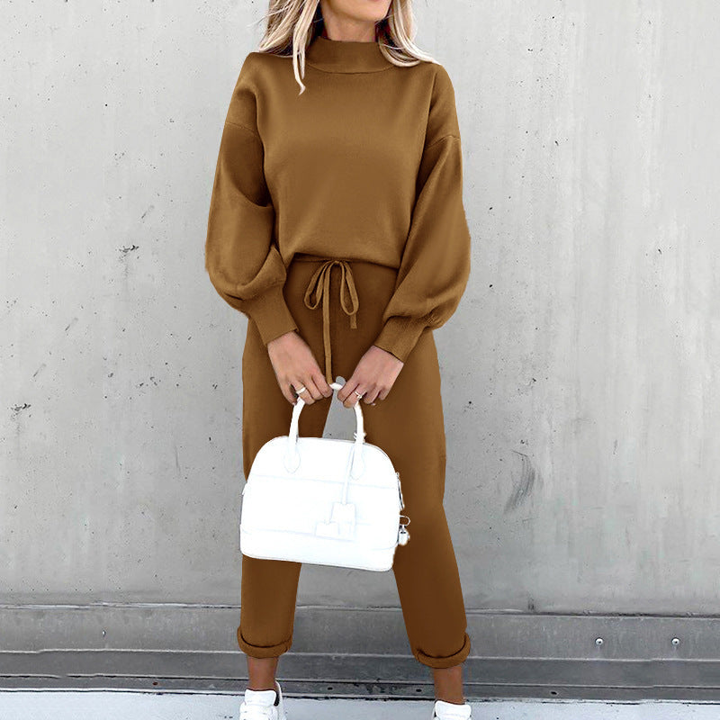 Women's cozy two-piece tracksuit set in neutral tones, relaxed-fit sweatshirt and matching joggers