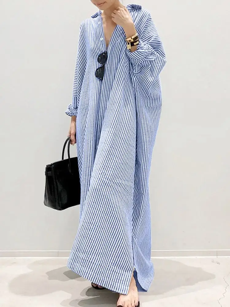 Women's striped maxi dress with voluminous puff sleeves, chic contemporary silhouette for all-day wear