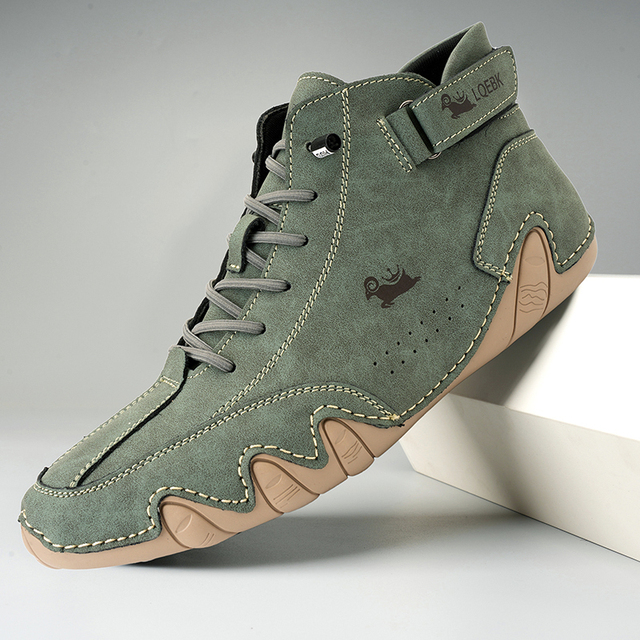 Men's casual lace-up ankle boots in neutral tones with durable stitching and urban rugged style