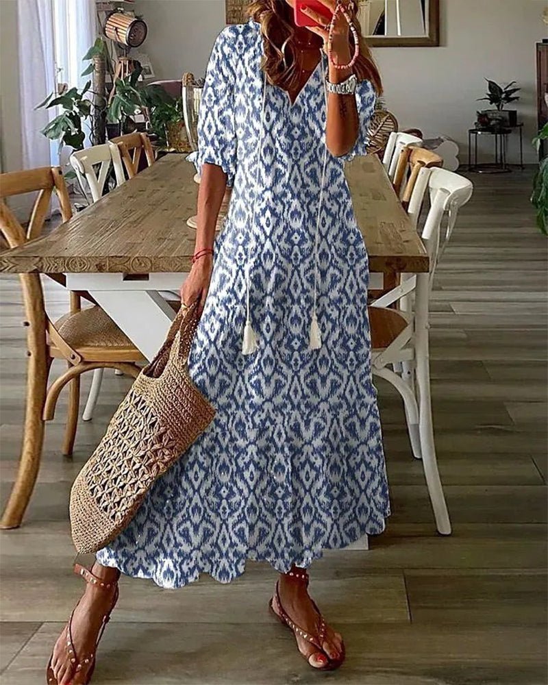 Boho maxi dress with V-neck tassel tie, flowy sleeves, relaxed silhouette in bohemian pattern