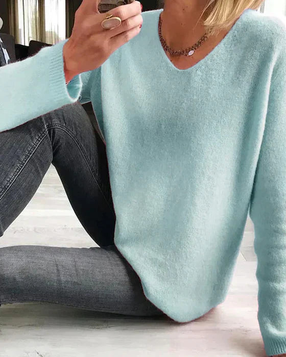Minimalist solid long sleeve knit sweater, soft sustainable fabric, versatile casual elegant style