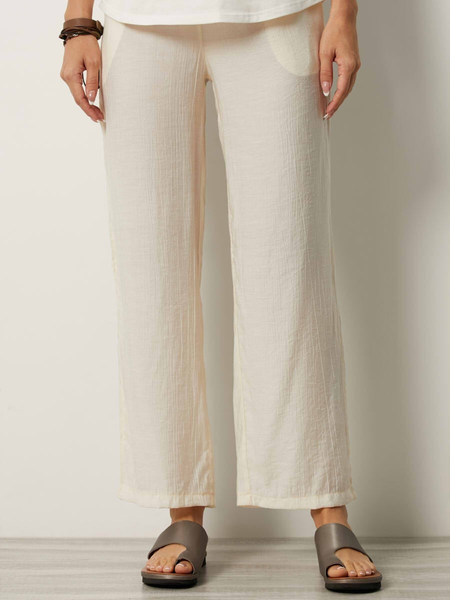Women's relaxed fit lightweight pants with elastic waist, side pockets, and subtle crinkled texture