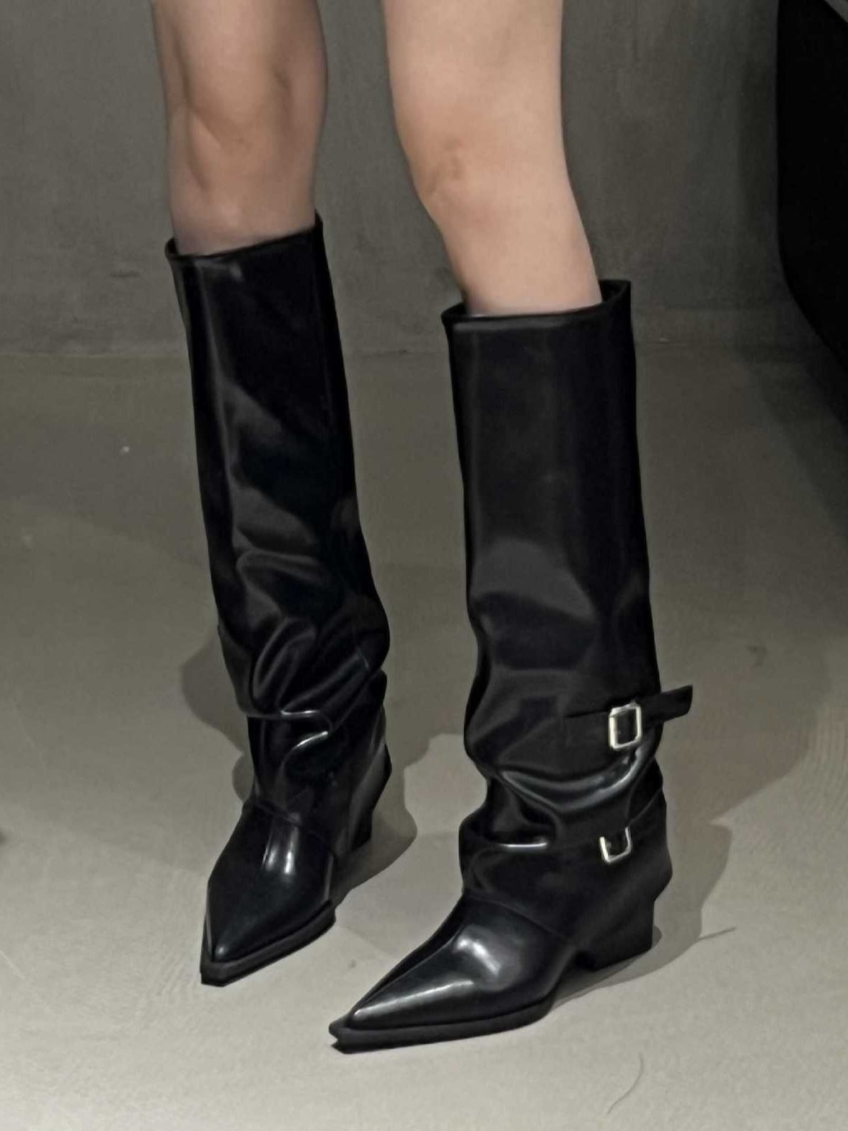 Women's black high-top block heel boots with pointed toe and edgy belt buckle detail