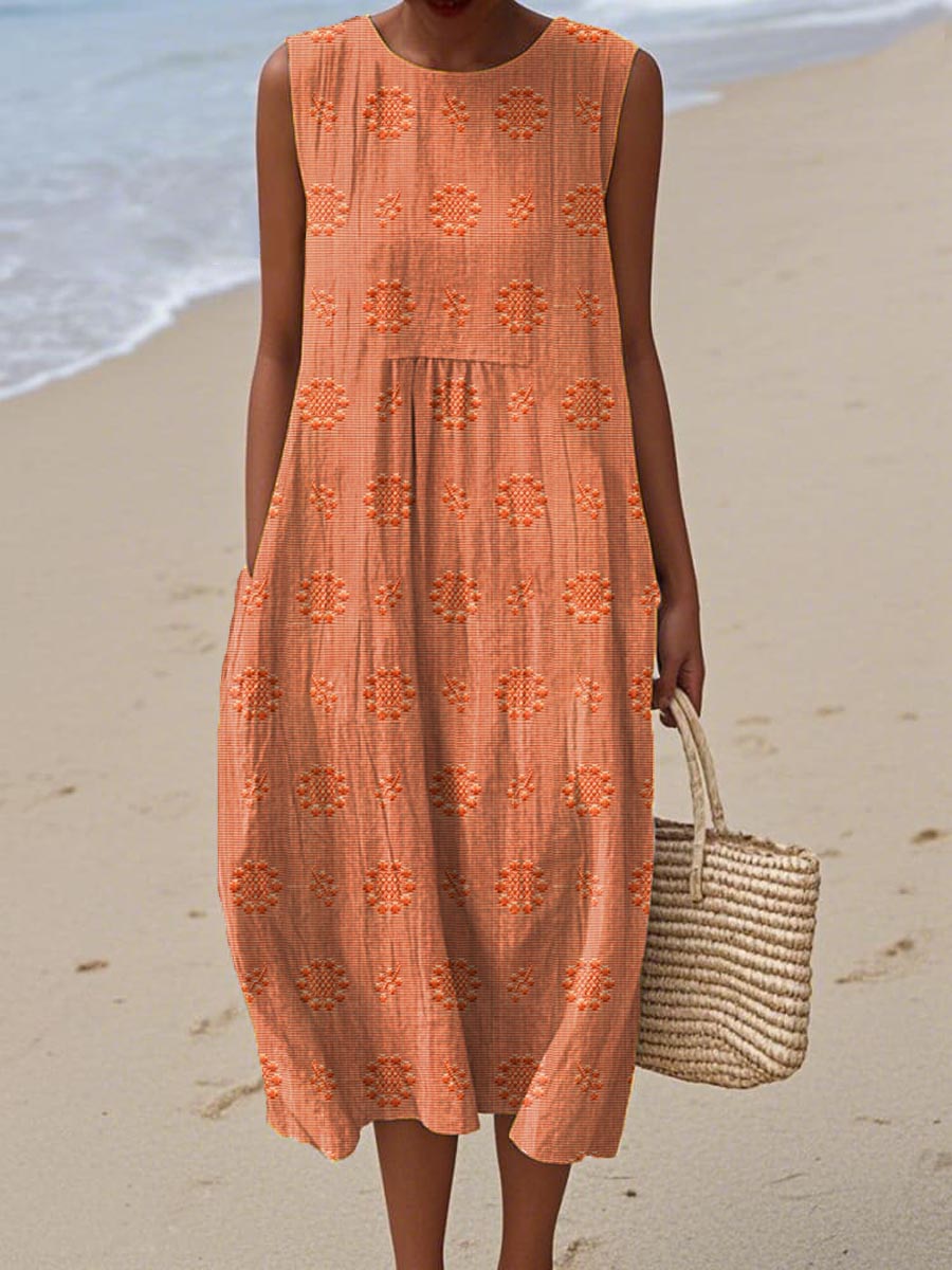 Women's sleeveless textured midi dress with gathered waist, circular print motifs, lightweight breezy beach style