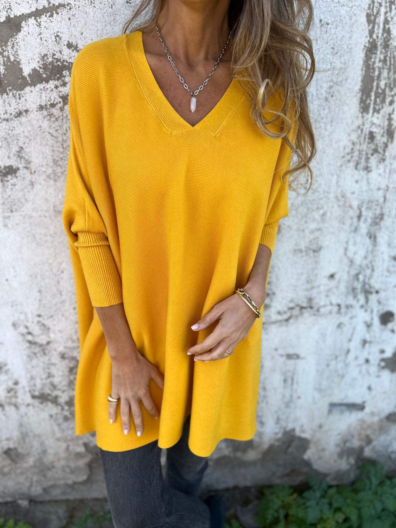 Women's relaxed V-neck winter sweater soft modern silhouette cozy everyday layering piece