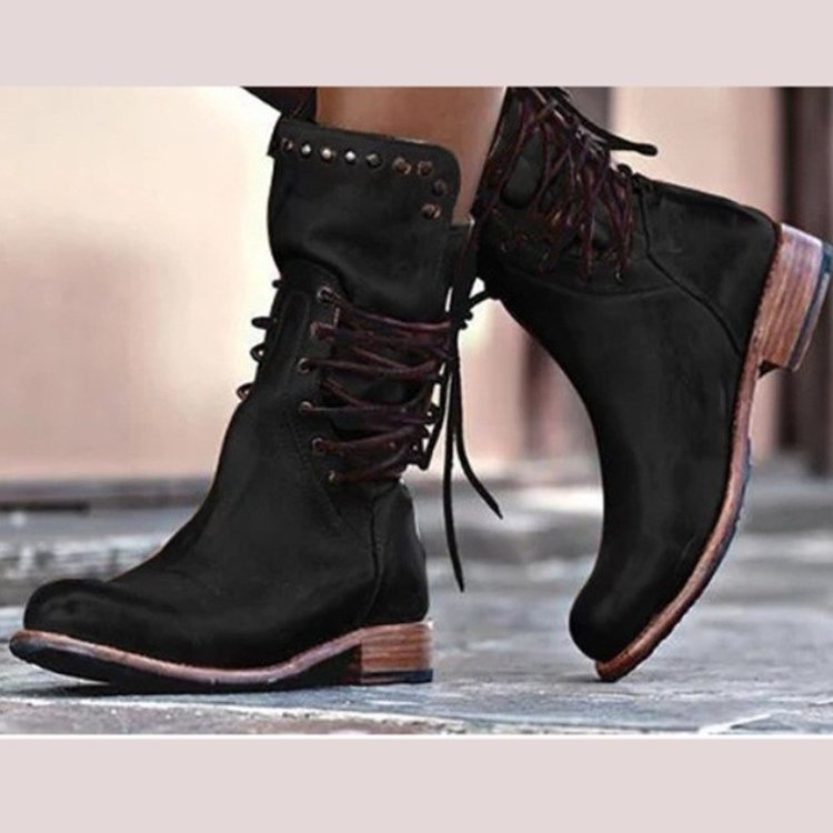 Women's brown retro mid-calf motorcycle boots with rivet details and slip-on block heel