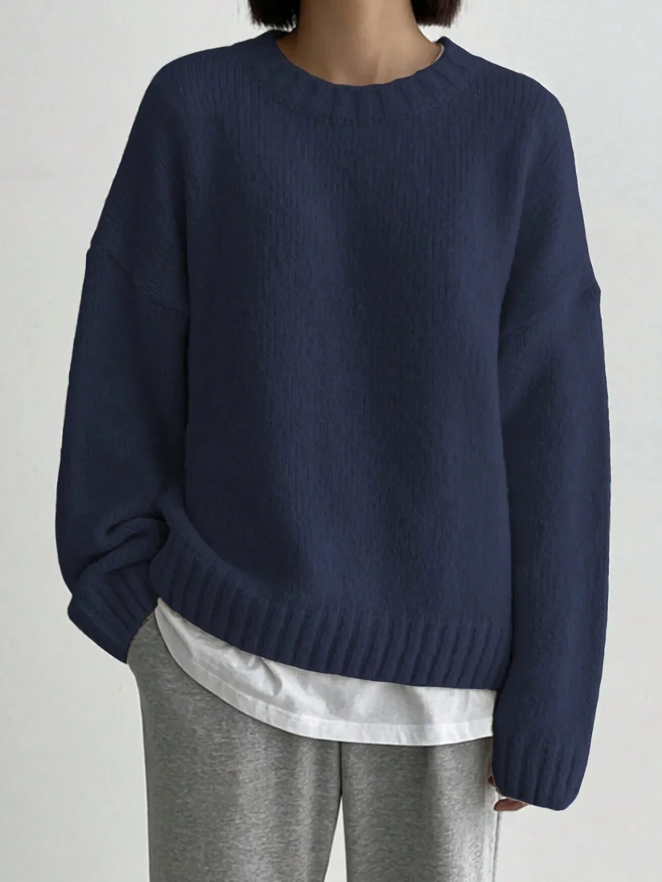 Women's pastel pink oversized knit sweater relaxed fit with ribbed neckline cuffs and hemline