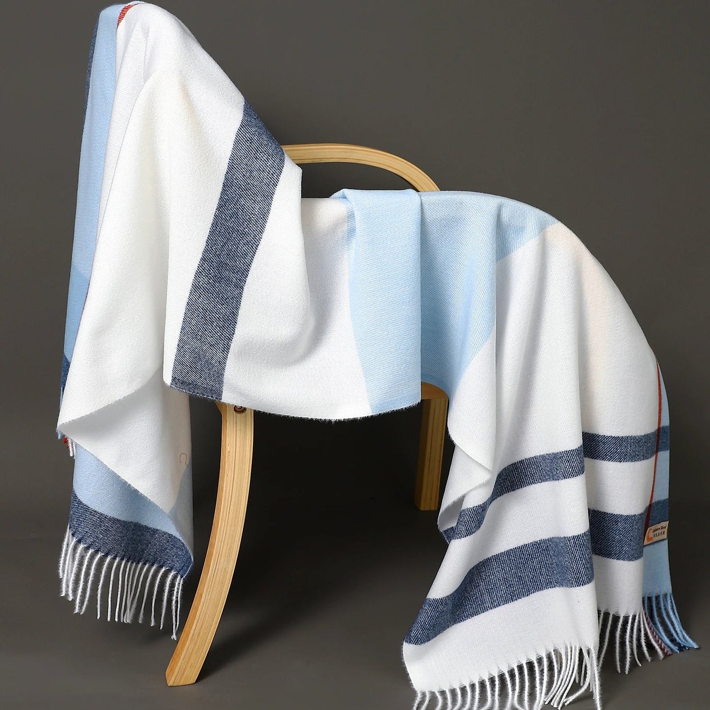 Women's oversized plaid wool shawl in classic cozy tones, wide drape winter wrap accessory