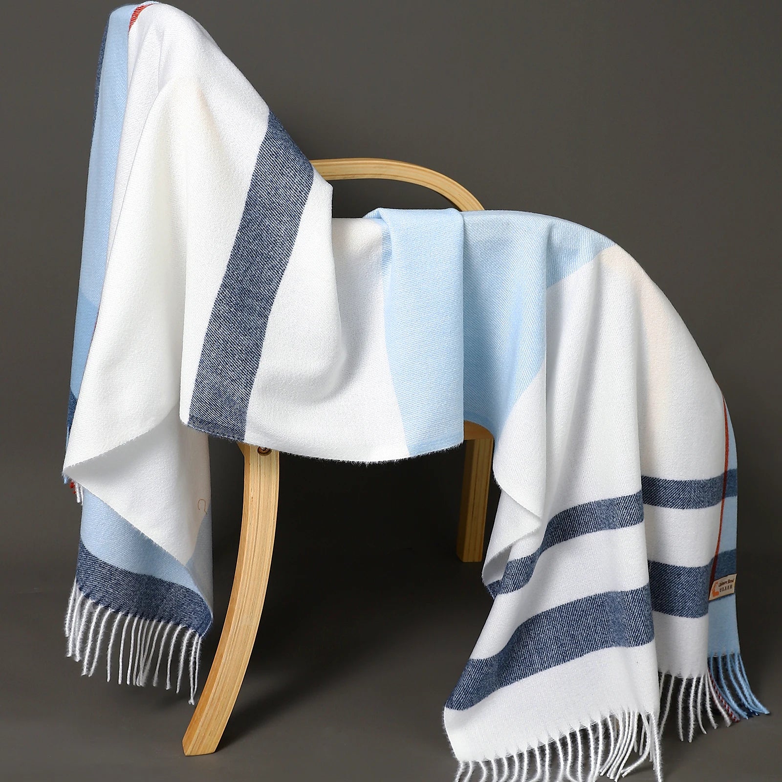 Women's oversized plaid wool shawl in classic cozy tones, wide drape winter wrap accessory