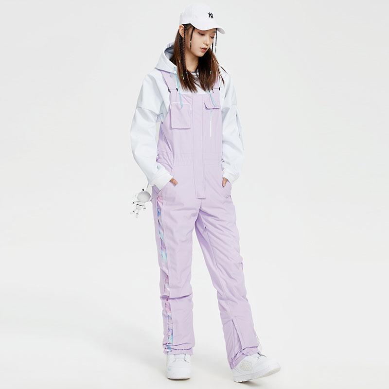 Women's waterproof ski bib pants with adjustable suspenders, snow gaiters, and fully taped seams