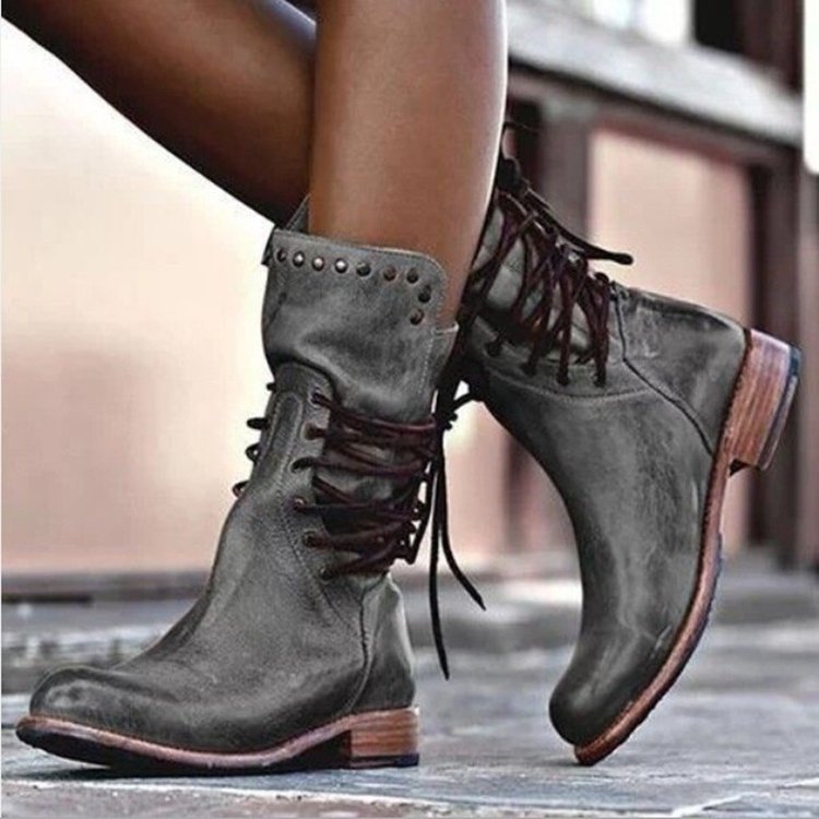 Women's brown retro mid-calf motorcycle boots with rivet detail and medium block heel