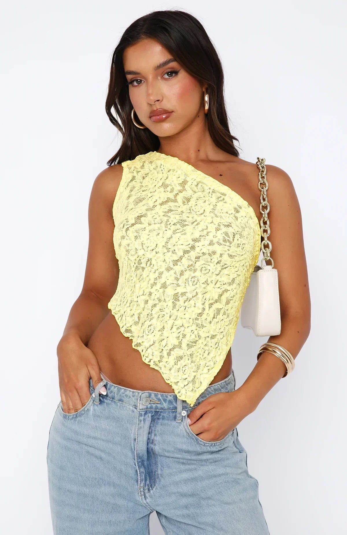 Women's white floral lace cropped one-shoulder top with asymmetric hem, fitted silhouette