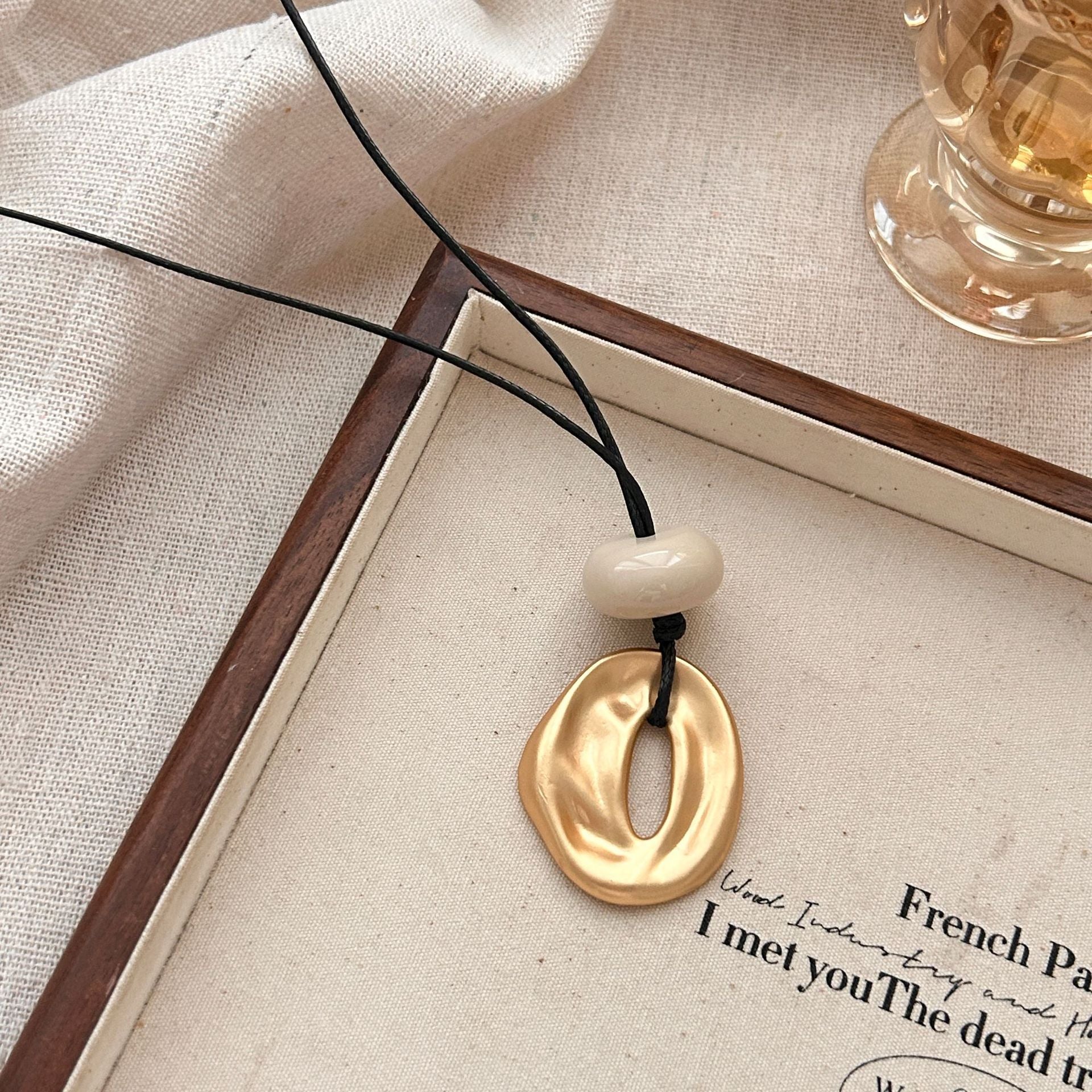 Geometric matte copper alloy openwork oval pendant necklace, long adjustable 71-80cm chain length