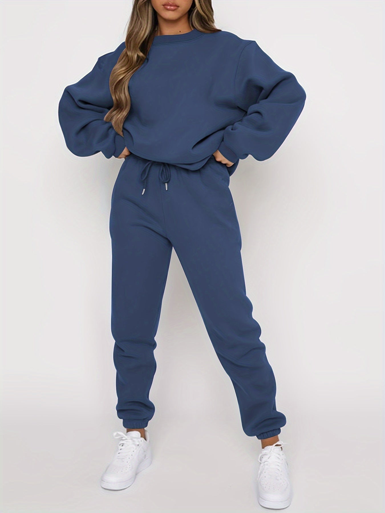 Women's soft oversized sweatshirt and high-waisted joggers set in cozy casual loungewear style