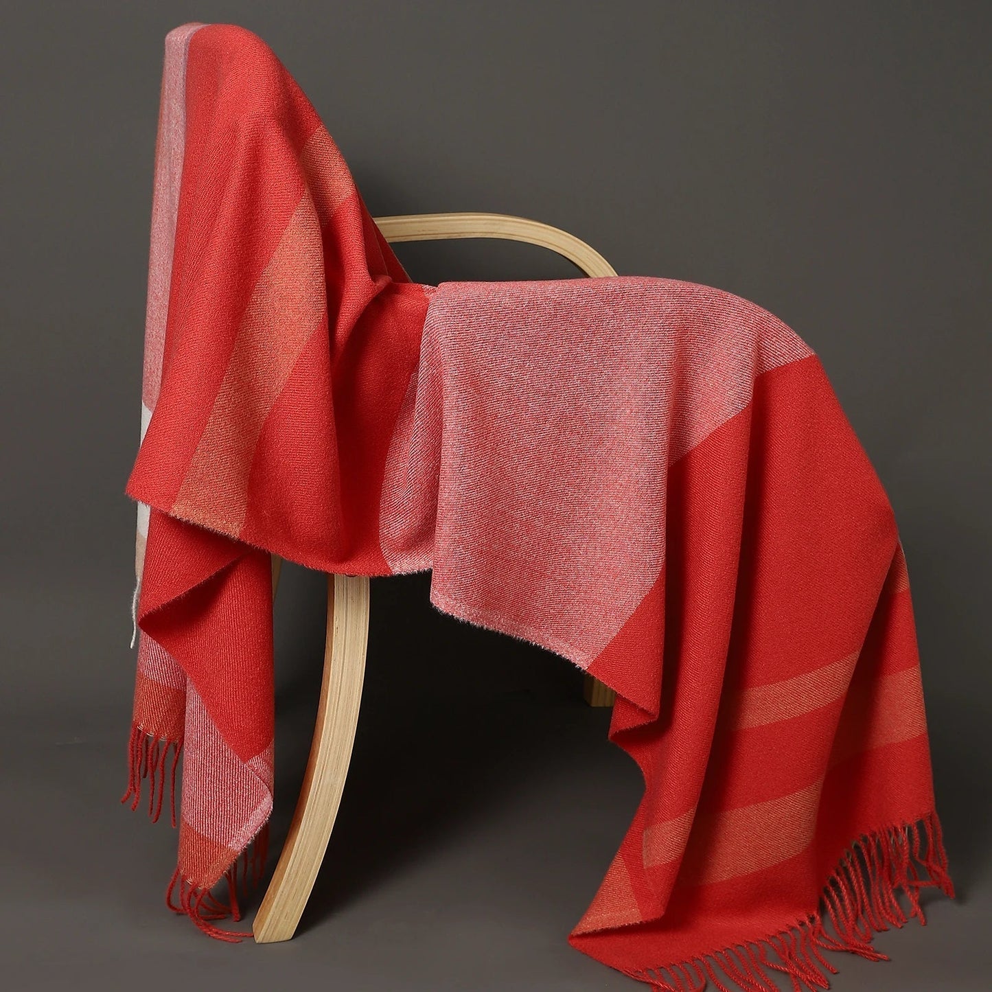 Women's oversized plaid wool shawl in classic tartan pattern, cozy winter wrap with generous coverage