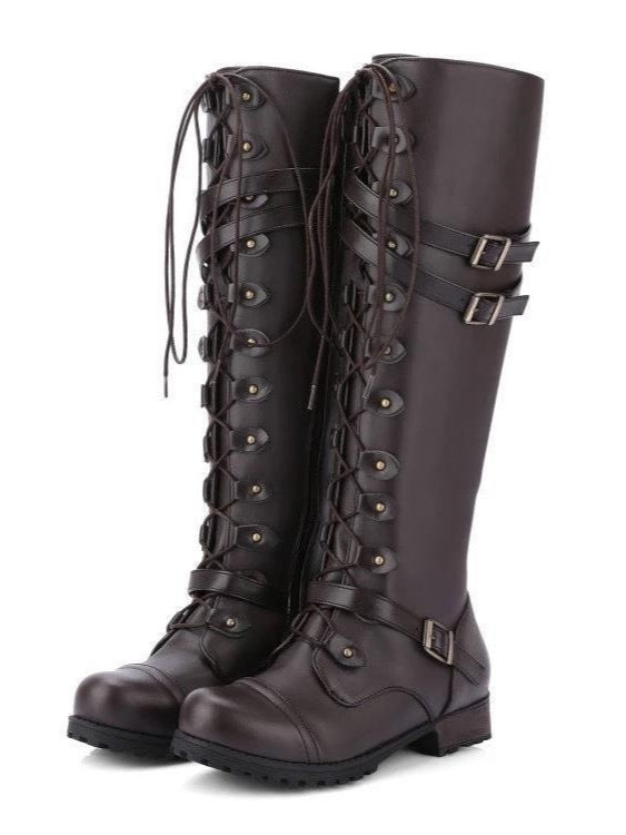 Women's black high-top biker boots with belt buckle rivets, lace-up closure, and leather panel detailing