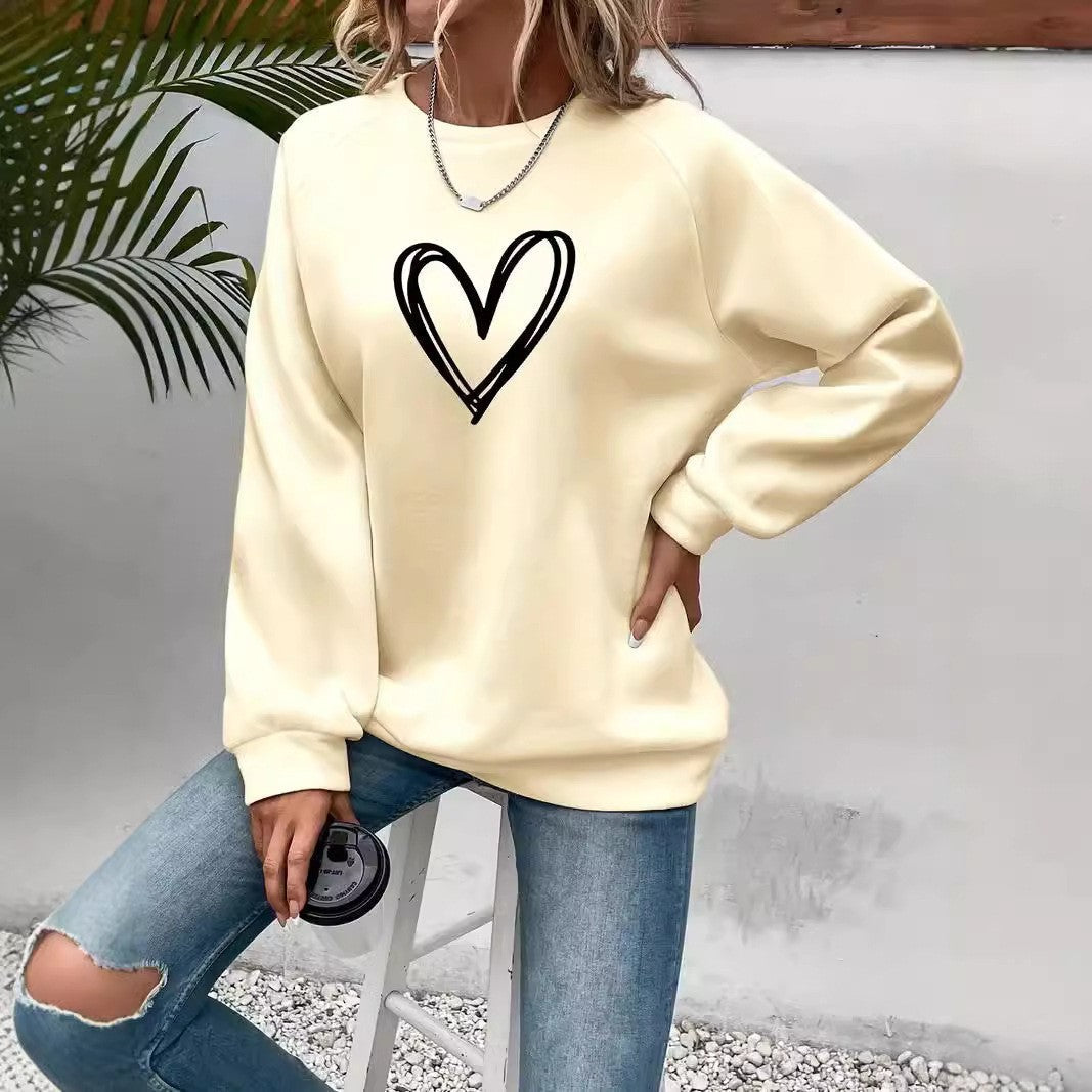 Women's pink crew neck sweatshirt with heart print, long sleeve cozy everyday pullover