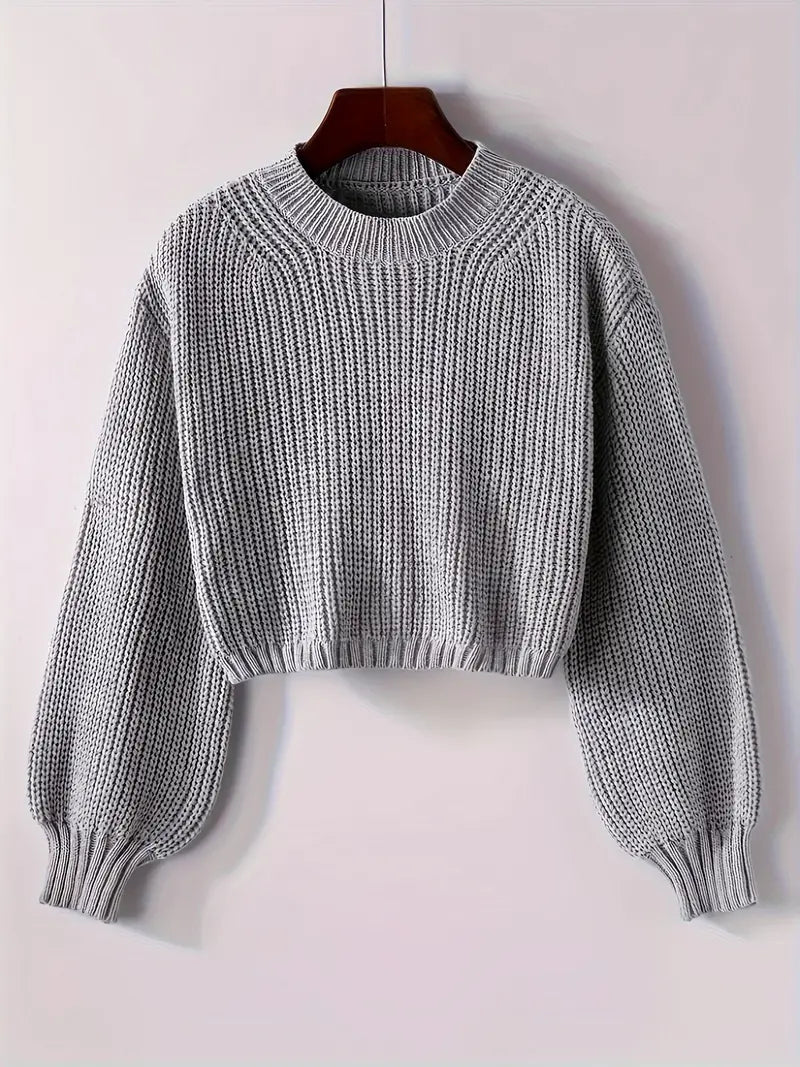 Women's cropped ribbed knit sweater in cozy winter style with modern short silhouette for layering