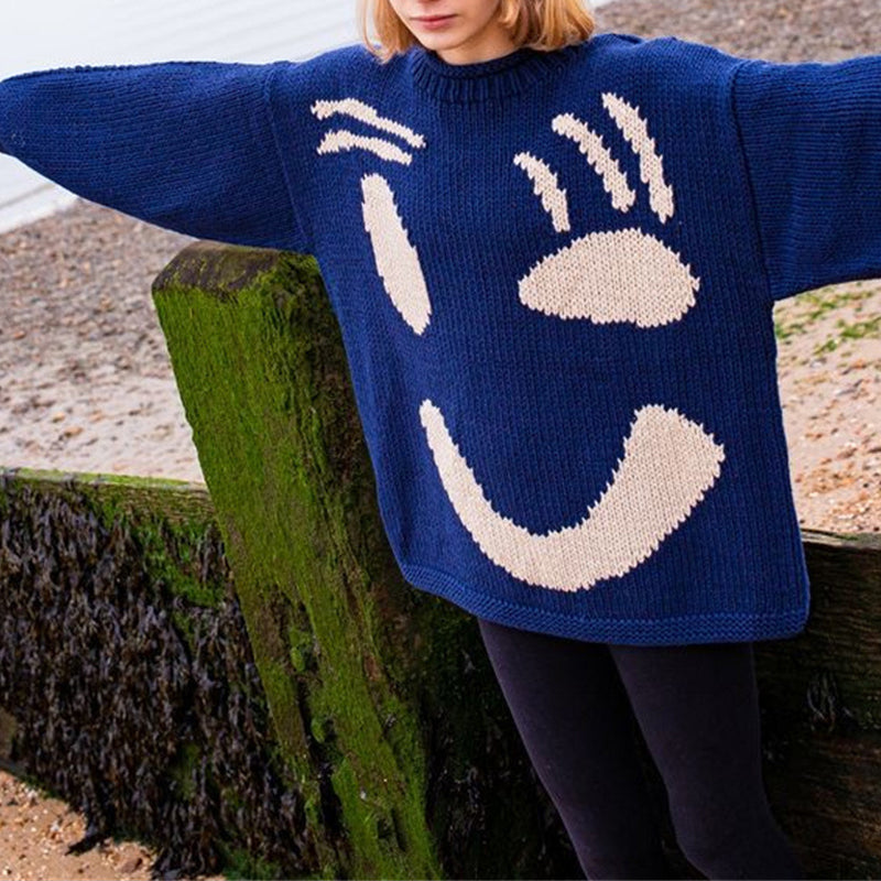 Cozy unisex smiley face knit sweater in neutral tones, retro casual cotton blend with stretchy comfort fit