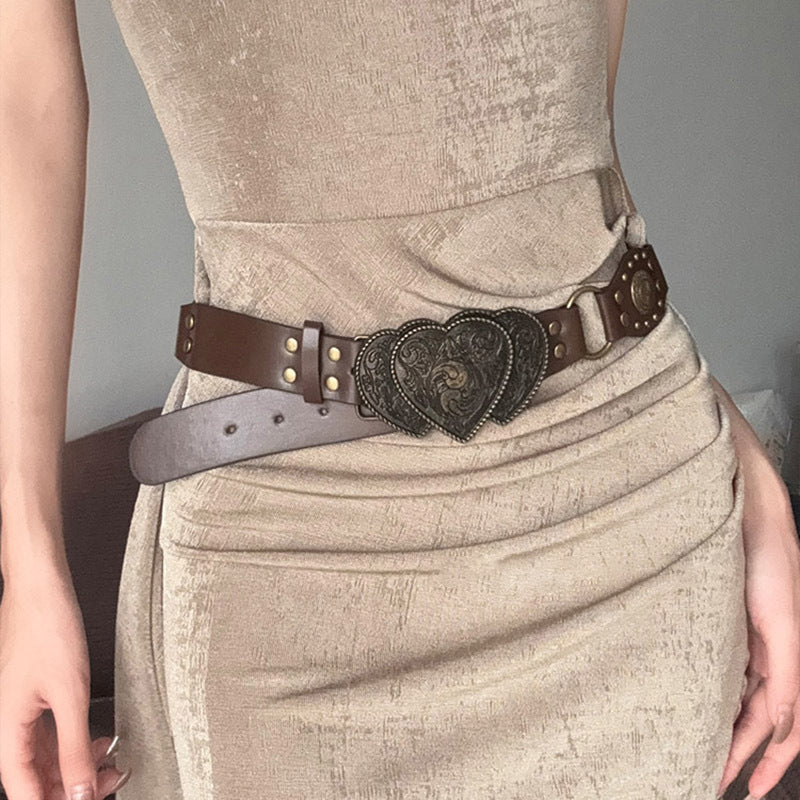 Women's brown leather boho belt with vintage-inspired design, versatile wardrobe essential